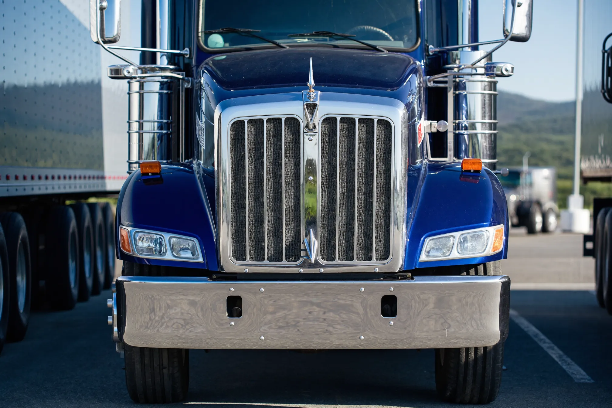 Semi tractor parked at a truck stop in early morning light